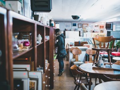 woman standing beside shelf